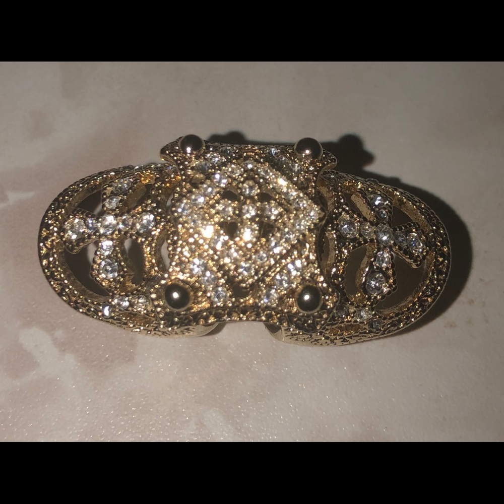 Decorative costume ring with cross symbol